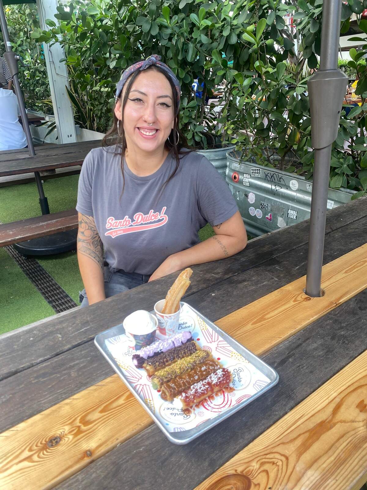 Gabriela Mejía, manager of Santo Dulce!, with the “World Cup churros” — inspired by teams such as Argentina’s Albiceleste, Spain’s La Roja, and Colombia’s Tricolor — featuring ingredients like dulce de leche, chocolate, guava, goat cheese and llanero cheese.